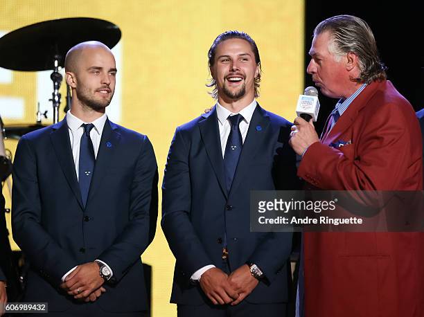 Barry Melrose talks with Niklas Hjalmarsson and Erik Karlsson of Team Sweden on stage for the opening ceremonies during the World Cup of Hockey 2016...