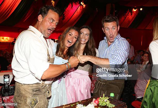 Marcus Gruesser and his girlfriend Sylvie Lindenbauer, Jan Hartmann and his wife Julia Hartmann during the Birgitt Wolff's Pre-Wiesn party, ahead of...