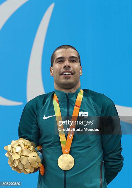 Gold medalist Daniel Dias of Brazil celebrates on the podium at the medal ceremony for the Men's 50m Backstroke - S5 on day 9 of the Rio 2016...