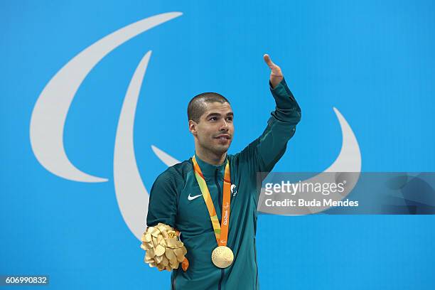 Gold medalist Daniel Dias of Brazil celebrates on the podium at the medal ceremony for the Men's 50m Backstroke - S5 on day 9 of the Rio 2016...