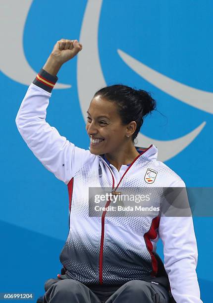 Gold medalist Teresa Perales of Spain celebrates on the podium at the medal ceremony for the Women's 50m Backstroke - S5 on day 9 of the Rio 2016...