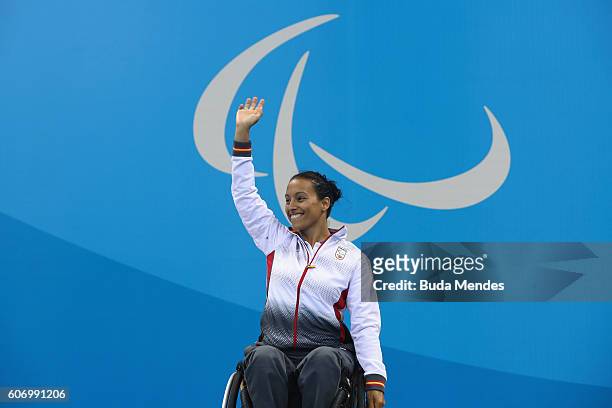 Gold medalist Teresa Perales of Spain celebrates on the podium at the medal ceremony for the Women's 50m Backstroke - S5 on day 9 of the Rio 2016...