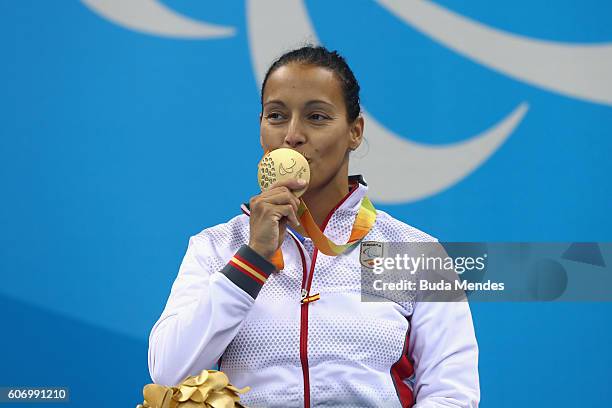 Gold medalist Teresa Perales of Spain celebrates on the podium at the medal ceremony for the Women's 50m Backstroke - S5 on day 9 of the Rio 2016...