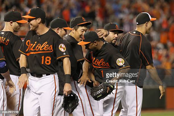 Michael Bourn of the Baltimore Orioles celebrates with teammates after the Orioles 5-4 win over the Tampa Bay Rays at Oriole Park at Camden Yards on...
