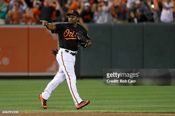 Michael Bourn of the Baltimore Orioles celebrates after throwing out Mikie Mahtook of the Tampa Bay Rays for the last out of the Orioles 5-4 win at...