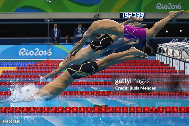 Swimmers dive to compete in the Men's 100m Freestyle - S13 Final on day 9 of the Rio 2016 Paralympic Games at the Olympic Aquatics Stadium on...