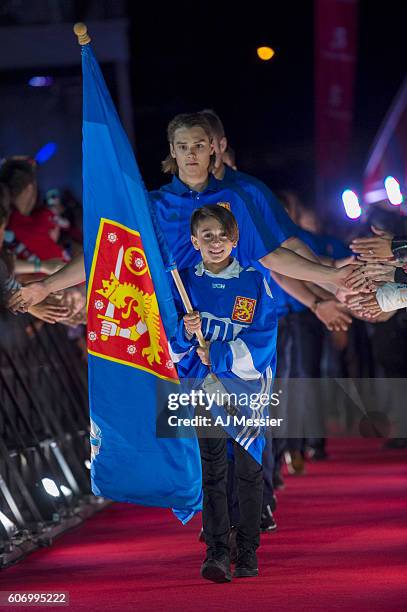 Scotiabank flag kids lead in Team Finland to the opening ceremonies during the World Cup of Hockey 2016 at the Scotiabank Fan Village on September...
