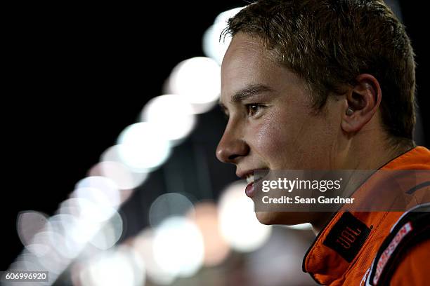 Christopher Bell, driver of the JBL Toyota, speaks with the media after the NASCAR Camping World Truck Series American Ethanol E15 225 at Chicagoland...