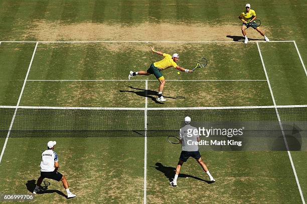 Sam Groth of Australia volleys playing with John Peers in the doubles match against Andrej Martin and Igor Zelenay of Slovakia during the Davis Cup...