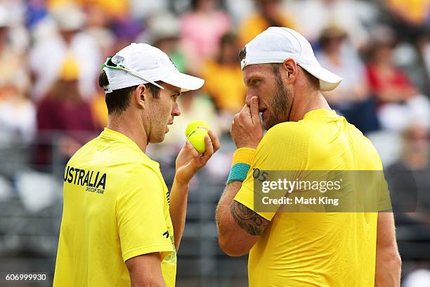 Sam Groth and John Peers of Australia talk in the doubles match against Andrej Martin and Igor Zelenay of Slovakia during the Davis Cup World Group...