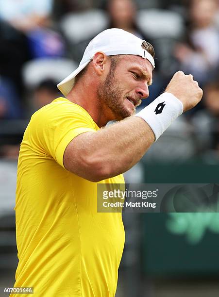 Sam Groth of Australia celebrates winning match point playing with John Peers in the doubles match against Andrej Martin and Igor Zelenay of Slovakia...