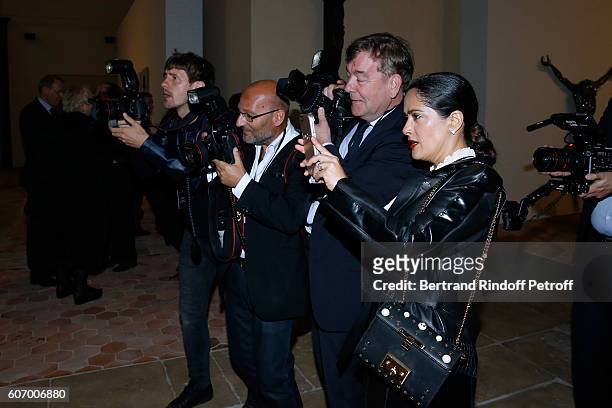 Actress Salma Hayek takes pictures during the 4O Rue de Sevres : Preview at the Head Offices of Both Kering and Balenciaga. Building. The site was...