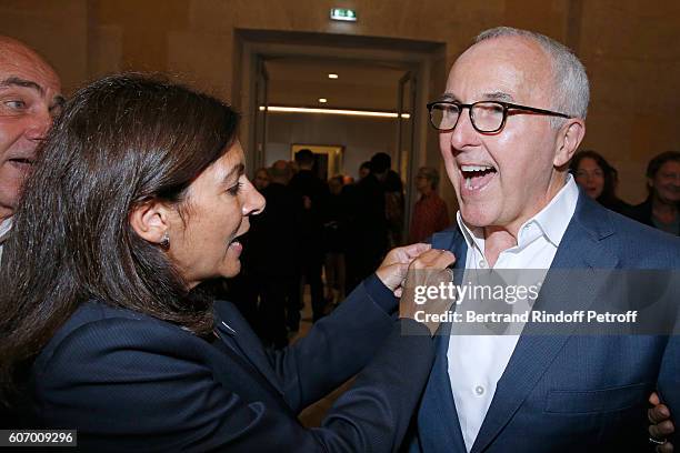 Mayor of Paris Anne Hidalgo gives a Pins of Paris 2024 Olympic Games Candidature to the President of the Olympique de Marseille Football Club, Frank...