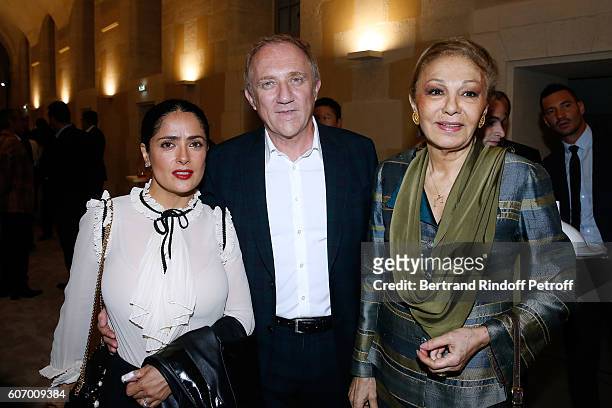 Of Kering Group, Francois-Henri Pinault standing between his wife actress Salma Hayek and Farah Pahlavi attend the 4O Rue de Sevres : Preview at the...