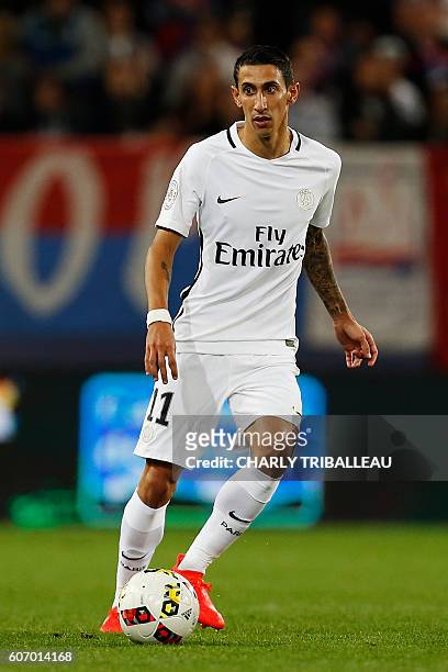 Paris Saint-Germain's Argentinian forward Angel Di Maria passes the ball during the French L1 football match between Caen and Paris , on September...