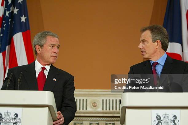 American President George W Bush and British Prime Minister Tony Blair speak during a press conference at the Foreign Office, London, England,...