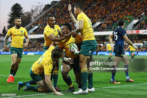 Samu Kerevi of the Wallabies is congratulated by team mates after scoring a try during the Rugby Championship match between the Australian Wallabies...