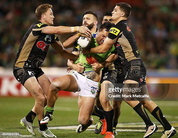 Jordan Rapana of the Raiders is tackled during the second NRL Semi Final match between the Canberra Raiders and the Penrith Panthers at GIO Stadium...