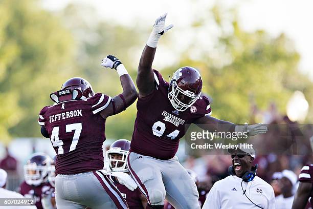 Jefferson celebrates with Nelson Adams of the Mississippi State Bulldogs after sacking the quarterback during a game against the South Carolina...