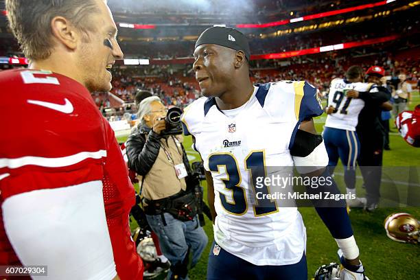 Blaine Gabbert of the San Francisco 49ers and Maurice Alexander of the Los Angeles Rams talk on the field following the game at Levi Stadium on...