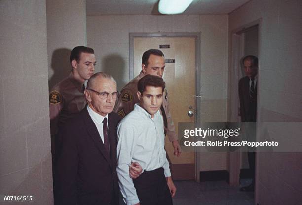 Jordanian Palestinian Sirhan Sirhan, accused of the murder of Senator Robert F Kennedy, is escorted by his lawyer Russell E Parsons and police...