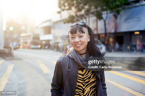 young woman in the street - 30 something asian woman stock pictures, royalty-free photos & images