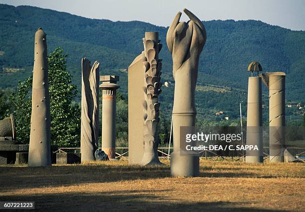 Columns-sculptures that surround the central sculpture depicting a sun disc, 1985-1989, Campo del Sole open-air museum, Tuoro, Lake Trasimeno,...