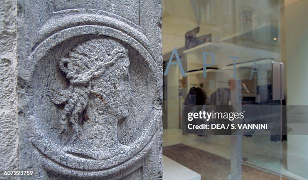 Bas-relief, detail of an old doorway made from soapstone, Chiavenna, Lombardy, Italy.
