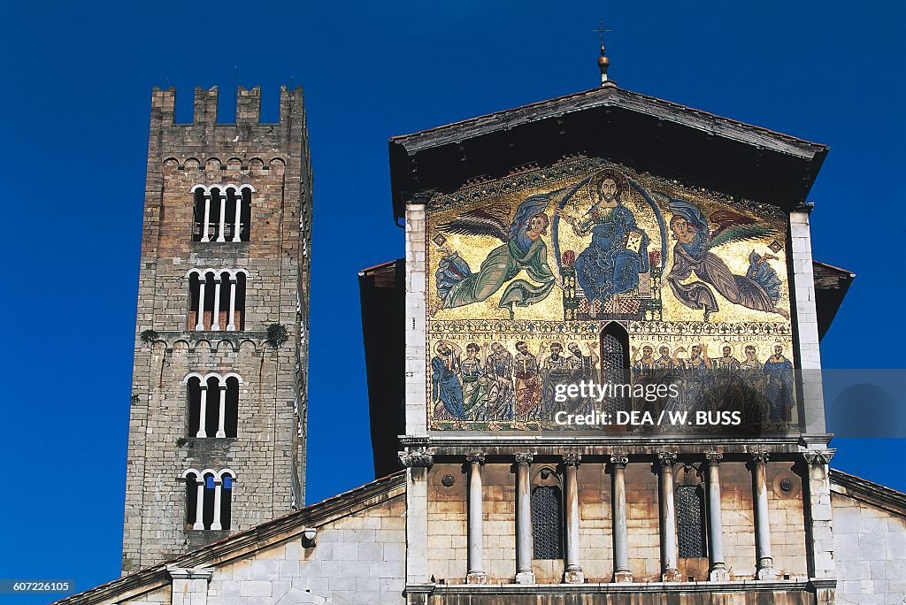 Facade of Basilica of San Frediano, 1147, with false loggia and mosaic depicting Ascension of Christ among angels and apostles, with bell tower in background, Lucca, Tuscany, Italy, 12th century