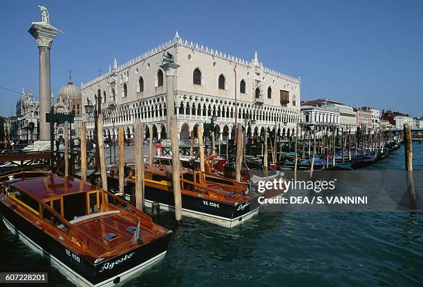 Gondolas in front of the Doge's Palace, Venice , Veneto. Italy, 14th-15thcentury.