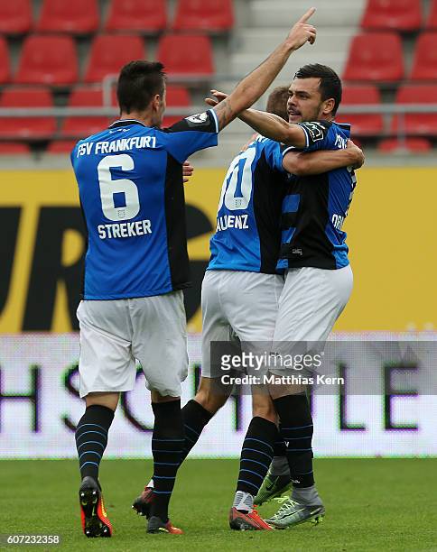 Massimo Ornatelli of Frankfurt jubilates with team mates after scoring the first goal during the third league match between Hallescher FC and FSV...