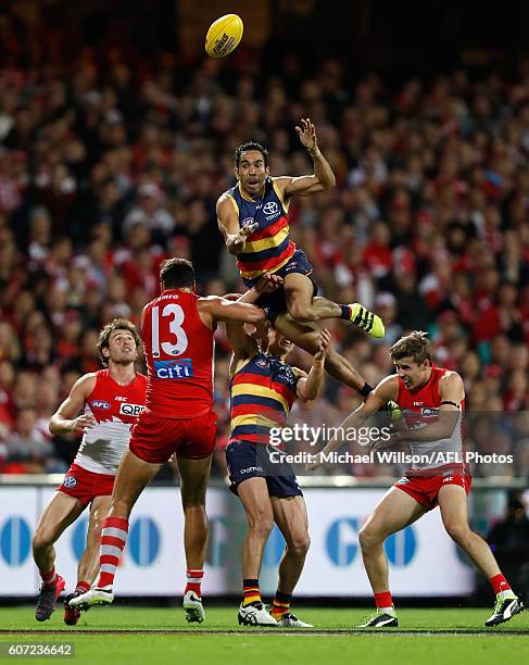 Eddie Betts of the Crows attempts a spectacular mark over Jarryd Lyons of the Crows and Jake Lloyd of the Swans during the 2016 AFL First Semi Final...