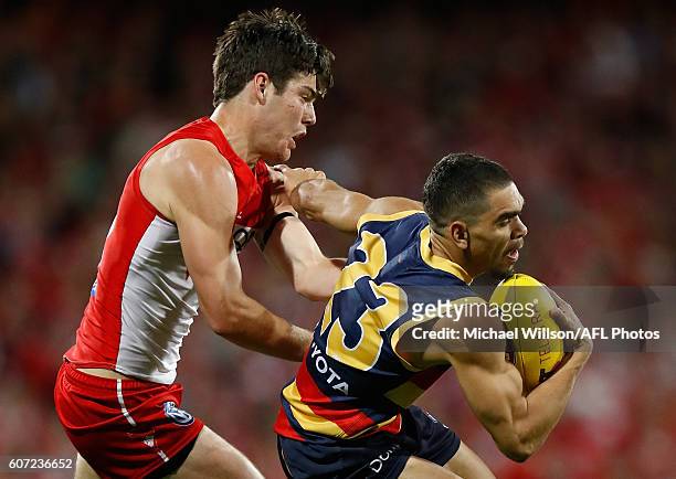 Charlie Cameron of the Crows is tackled by George Hewett of the Swans during the 2016 AFL First Semi Final match between the Sydney Swans and the...