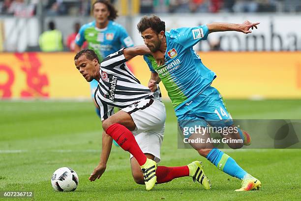 Timothy Chandler of Frankfurt is challenged by Admir Mehmedi of Leverkusen during the Bundesliga match between Eintracht Frankfurt and Bayer 04...