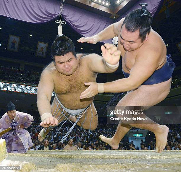 Sekiwake Takayasu defeats Mongolian yokozuna Kakuryu on the seventh day of the Autumn Grand Sumo Tournament at Ryogoku Kokugikan in Tokyo on Sept....