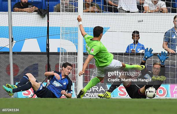 Mario Gomez of Wolfsburg misses to score against goalkeeper Oliver Baumann of Hoffenheim during the Bundesliga match between TSG 1899 Hoffenheim and...