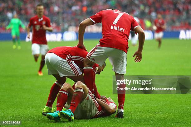 Rafinha of Muenchen celebrates scoring the 3rd team goal with his team mates during the Bundesliga match between Bayern Muenchen and FC Ingolstadt 04...