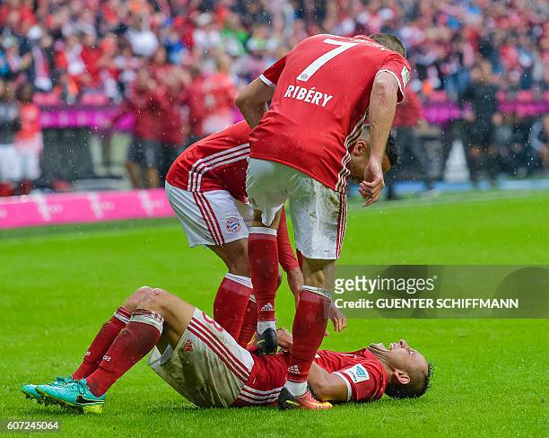 Bayern Munich's Brazilian defender Rafinha celebrates his goal with Bayern Munich's French midfielder Franck Ribery and Bayern Munich's Spanish...
