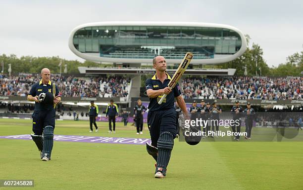 Jonathan Trott and Tim Ambrose of Warwickshire leaves the field after winning the Royal London one-day cup final cricket match between Warwickshire...
