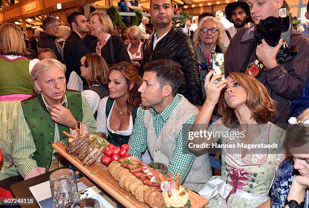 Uli Ferber, Andrea Berg, Andreas Ferber and Vanessa Mai during the opening of the 2016 Oktoberfest beer festival in the Schottenhamel tent at...