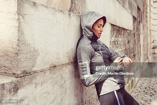 sports woman checking pulse - pedometer stock pictures, royalty-free photos & images