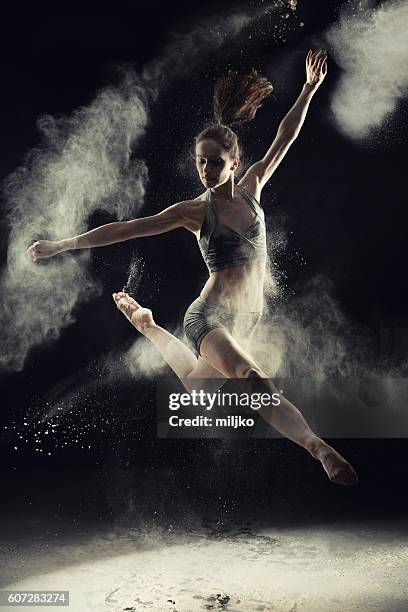 amazing ballet dancer dancing in powder snow - leotard stockfoto's en -beelden
