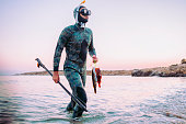 photo of a freediver coming back from spear fishing
