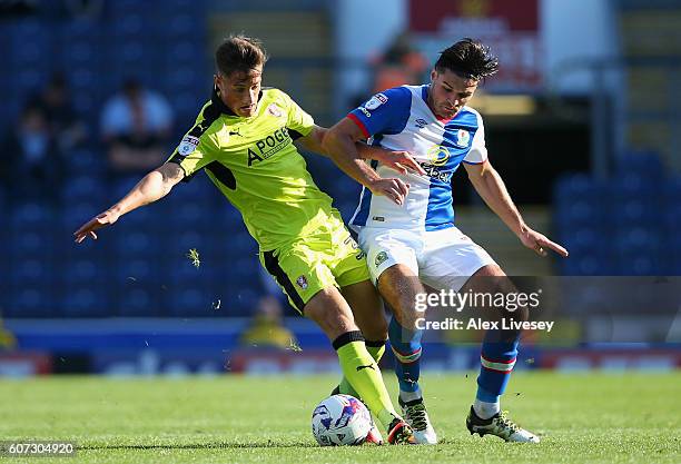 Ben Marshall of Blackburn Rovers is tackled by Jerry Yates of Rotherham United during the Sky Bet Championship match between Blackburn Rovers and...