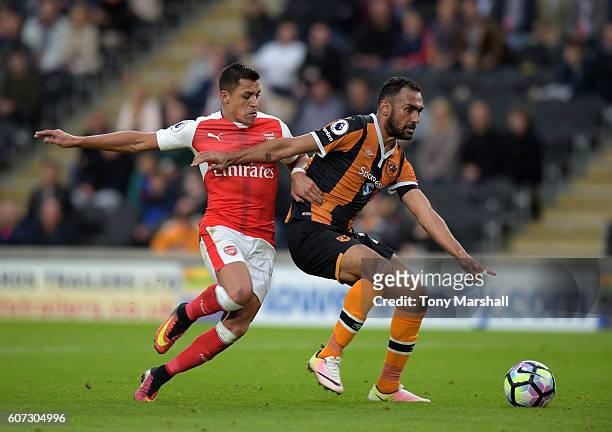 Ahmed Elmohamady of Hull City is tackled by Alexis Sanchez of Arsenal during the Premier League match between Hull City and Arsenal at KCOM Stadium...