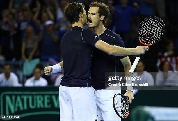 Andy Murray and Jamie Murray of Great Britain celebrate match point and a four set victory against Juan Martin Del Potro and Leonardo Mayer of...