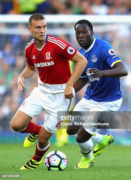 Ben Gibson of Middlesbrough is put under pressure from Romelu Lukaku of Everton during the Premier League match between Everton and Middlesbrough at...
