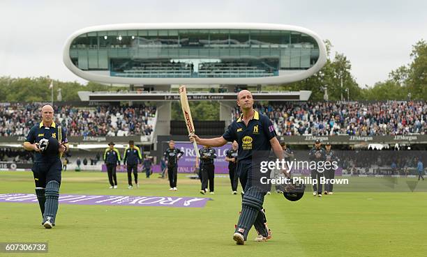 Jonathan Trott and Tim Ambrose of Warwickshire leave the field after winning the Royal London one-day cup final cricket match between Warwickshire...