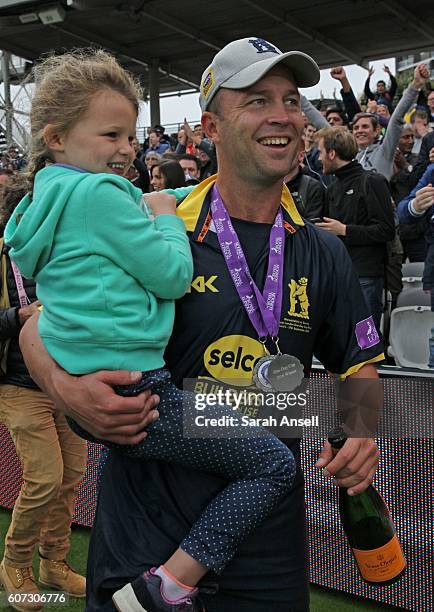 Jonathan Trott of Warwickshire celebrates with his daughter after winning the Royal London One-Day Cup Final after beating Surrey at Lord's Cricket...