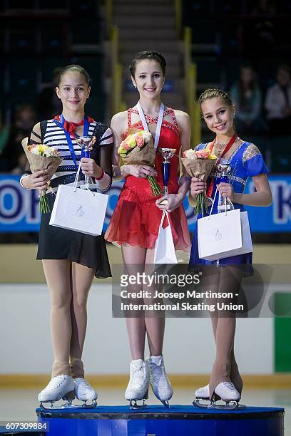 Stanislava Konstantinova, Polina Tsurskaya and Elizaveta Nugumanova of Russia pose during the Junior Ladies medal ceremony on day three of the ISU...